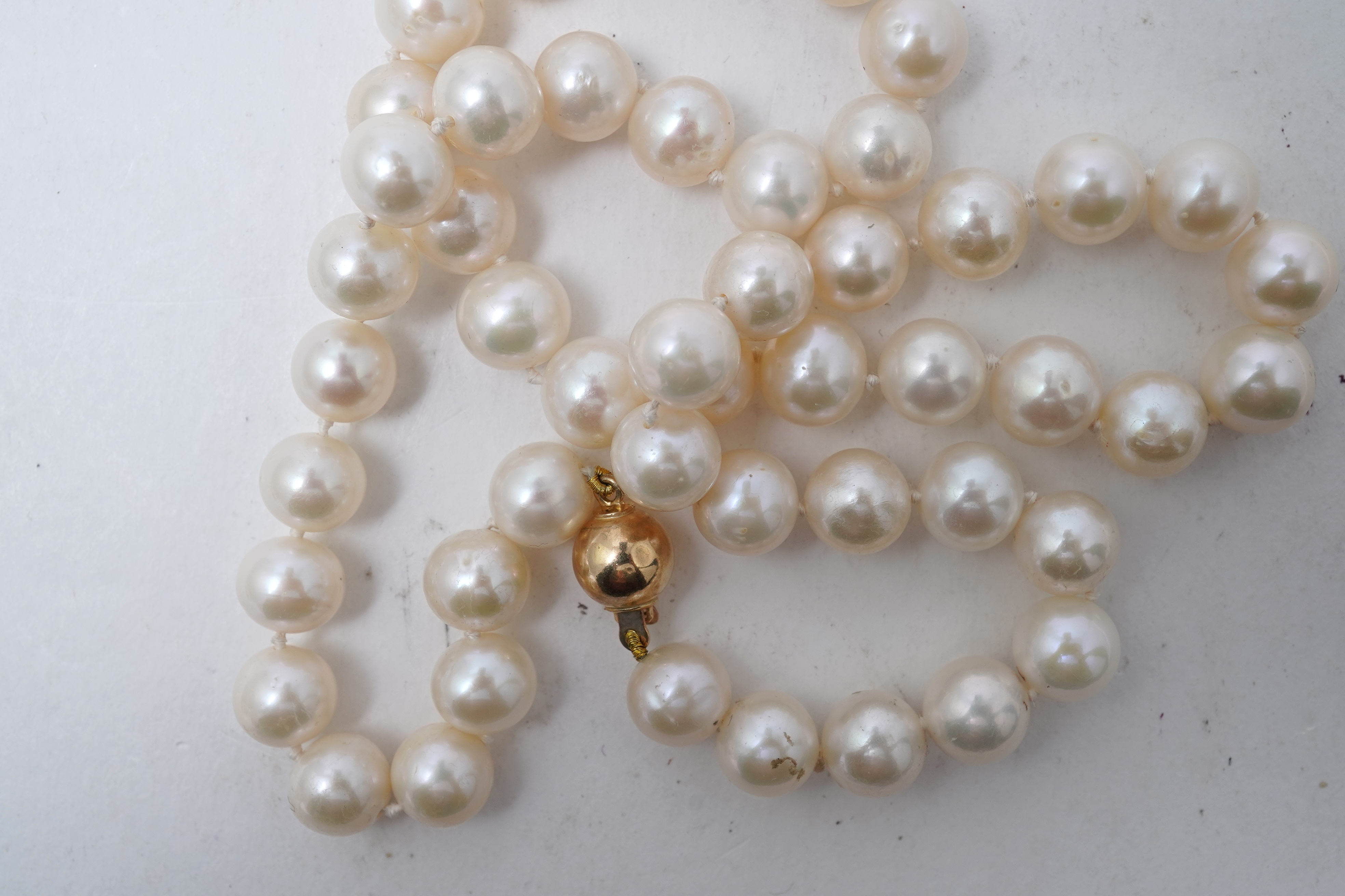 A collection of four cultured pearl necklaces